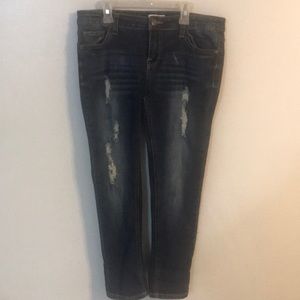 Blue roll cuff crop jeans with ripped details